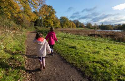 Two children walking in Abbey Fields, Kenilworth