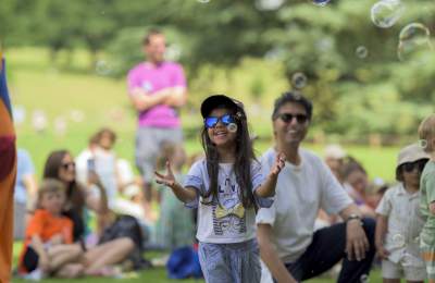 Children and adults enjoying the summer at Compton Verney