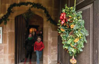 Two girls and a Christmas wreath
