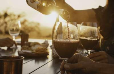 red wine being poured into a glass