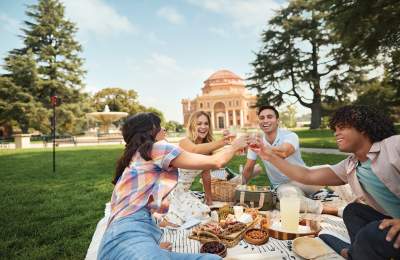 Friends enjoying a picnic on the lawn of the Sunken Gardens in Atascadero