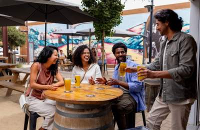 Friends enjoying a beer at Ancient Owl in Atascadero