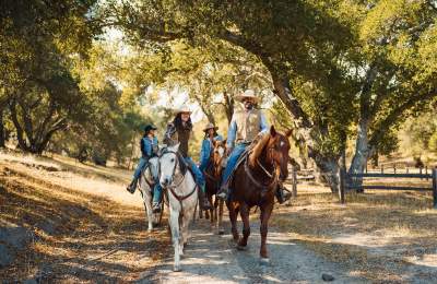 group horseback riding on a trail in Santa Margarita