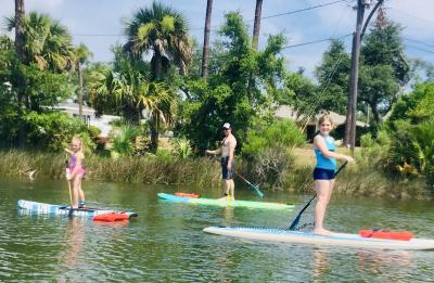 A  family Paddleboard Lesson on a lake