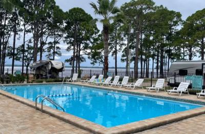 Enjoy pool time with a breeze and waterfront view.