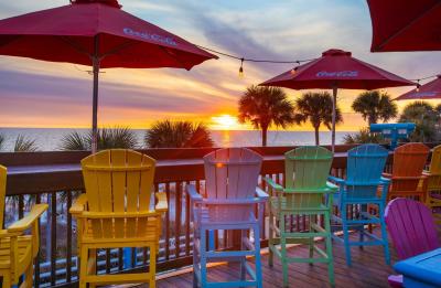 Gulf-front dining with complimentary sunset views