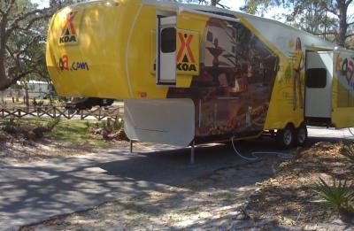 KOA 5th Wheel in a lakeside pull-thru