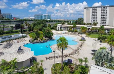 Soak up the sun and enjoy views of Universal's Volcano Bay at our resort pool and pool bar.