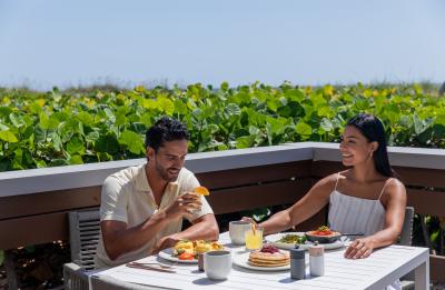 Couple enjoying breakfast at Caretta Caretta