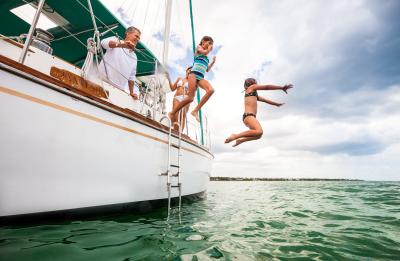 Family Jumping off of Sailboat
