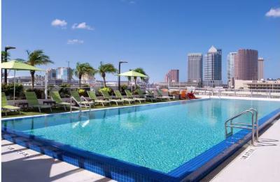 Rooftop pool deck and fire pit with city view