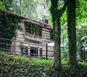 log cabin restaurant surrounded by trees