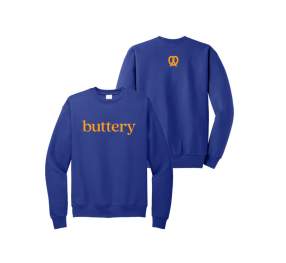 An Image of a blue branded Auntie Annie's sweatshirt. The front says "Buttery" and there is a pretzel on the back