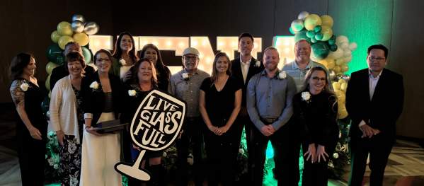 Group photo of Service Winners in formal attire