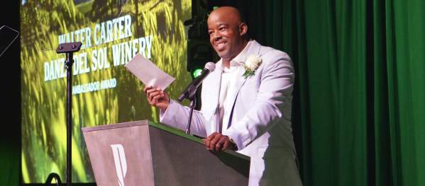 Walter Carter giving a speech at a podium