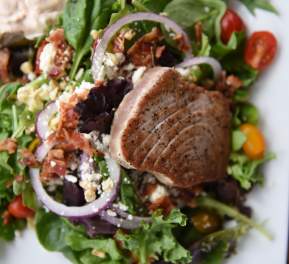 The grilled tuna & bacon salad from the Blue Water Grill Restaurant in the Pirate's Cove Marina.