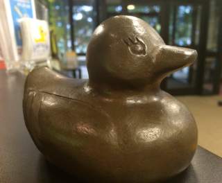 This is a picture of a bronze lucky duck for the Lucky Duck Scavenger Hunt in Huntsville