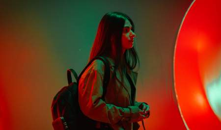 A girl walking through an arts installation