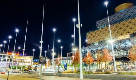 Birmingham Library at night, lit up by the free-standing lights of Centenary Square