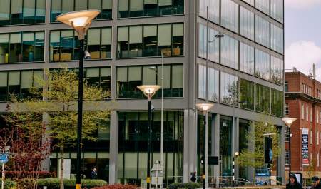 Looking across a square to the foot of a skyscraper