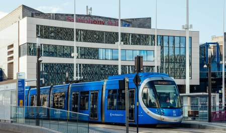 A West Midlands tram infront of Symphony Hall and the ICC