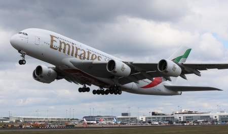 Emirates A830 plane flying out of Birmingham International Airport