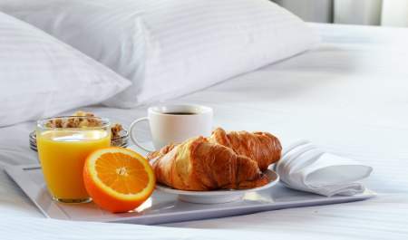 breakfast on a bed, white linen