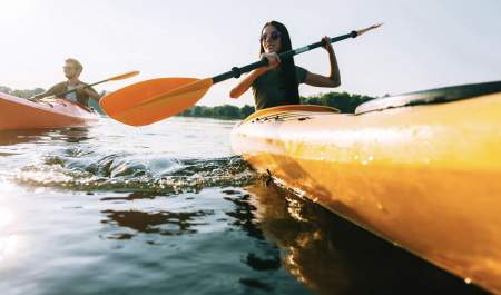 a couple in yellow kayaks