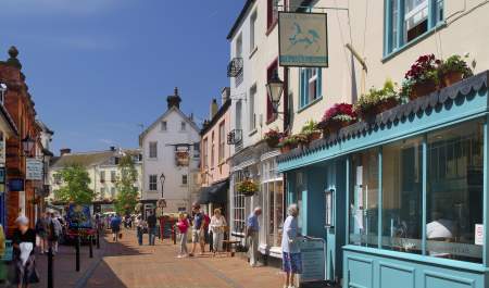 sidmouth high street with some people walking about