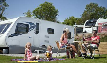 family outside caravans