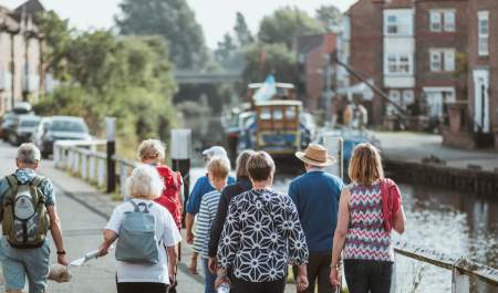 A group of people walking along the Beverley Beck in East Yorkshire