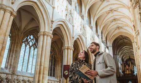 A couple look up in admiration of the amazing structure inside Beverley Minster in East Yorkshire