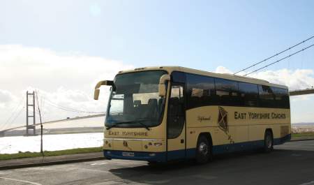 Coach parked, Humber Bridge in the background, A single span suspension bridge