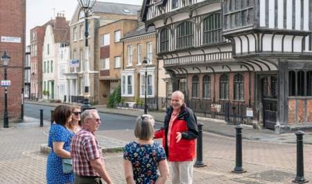 See Southampton Tour guide talking to small group of people outside Tudor House & Garden
