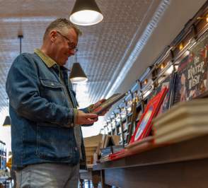 Man looking at book in bookshop