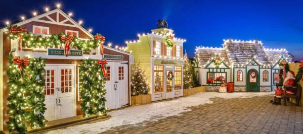 Houses glow with twinkling Christmas lights and other holiday decor.