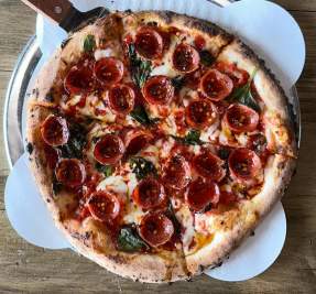 Pepperoni pizza on display