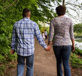 A couple enjoys a stroll at Dunbar Cave