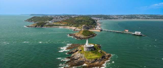 Mumbles drone low altitude Lighthouse towards Mumbles
