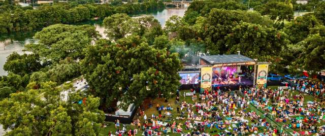 Aerial photo of Blues on the Green with downtown skyline in the background.