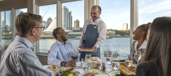 Interior-Server delivering Food to Window Table