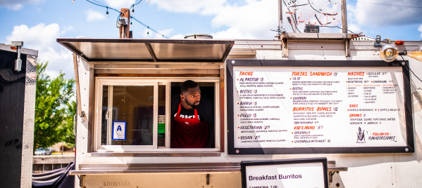 Bobby Portis sticking his head out of a taco food truck service window