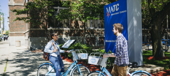 two college students by MATC campus on bublr bikes