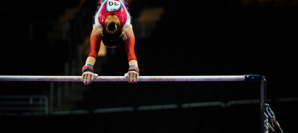 gymnast on the bars at the Fiserv Forum
