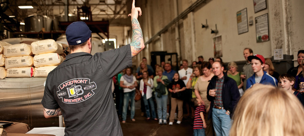 tour guide talking while crowd listens intently