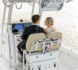 Bride and groom on a boat in the Golden Isles