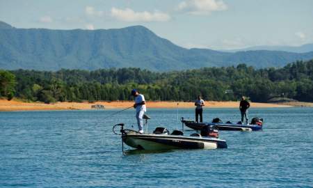 Men fishing on boats at Douglas Lake in Knoxville, TN