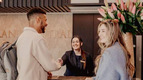 Couple checking in at The Grand Central Hotel