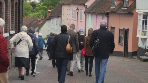 A group walk through Colchester's Dutch Quarter on a guided walking tour.