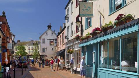 sidmouth high street with some people walking about
